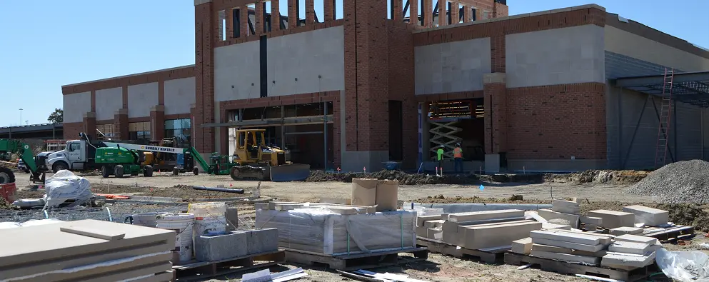 Incomplete building facade with construction activity
