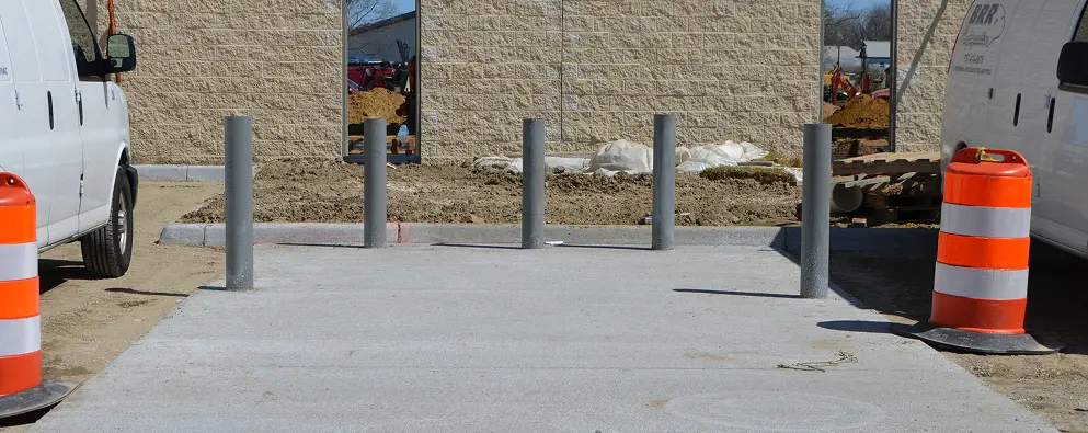 Building exterior with safety bollards