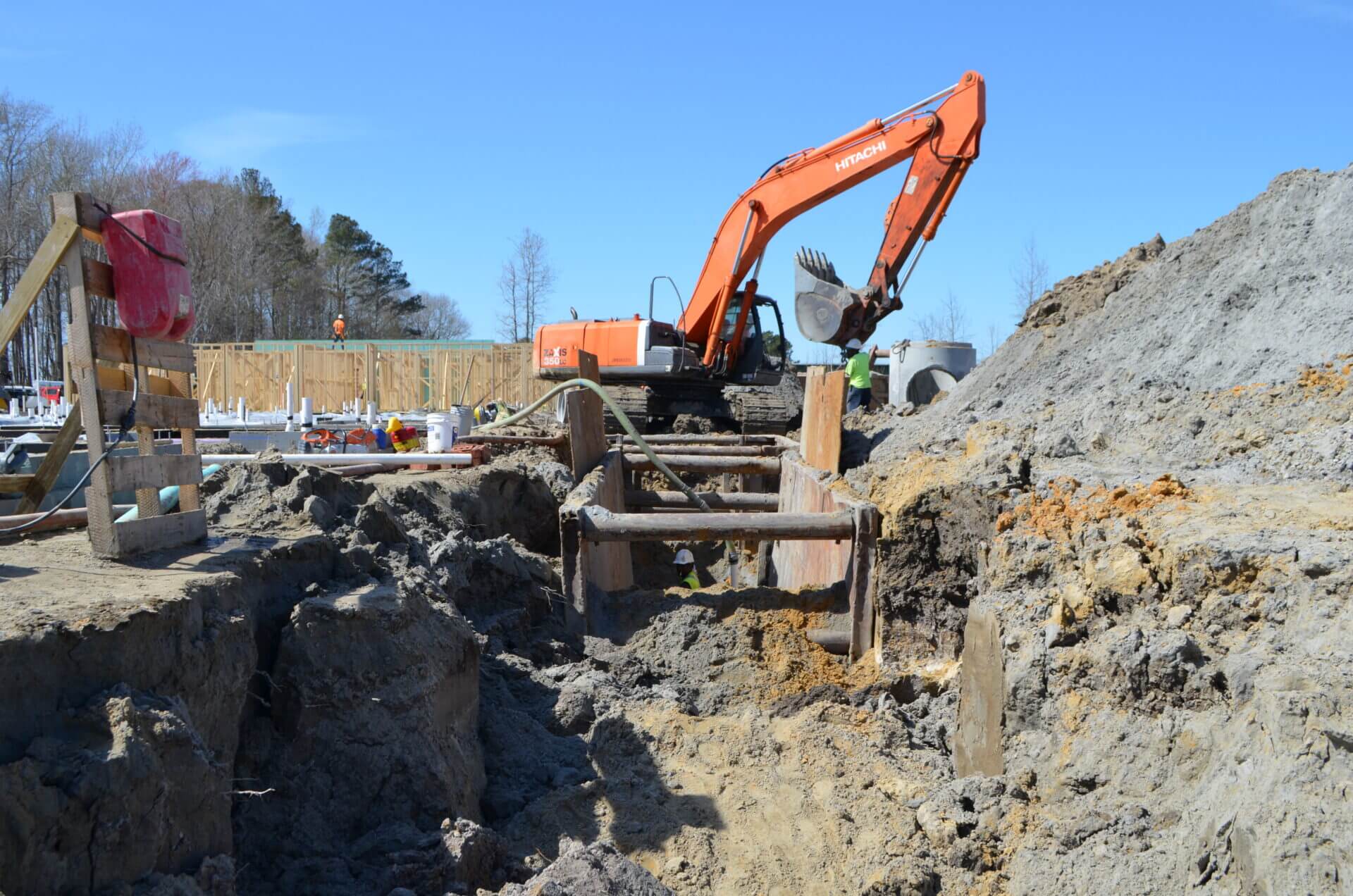 Construction site with orange excavator